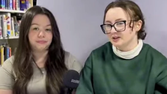 Courtney and Jodie, Health & Social Care students at Glasgow Kelvin College, sit side by side in a library setting, speaking into a microphone about their course experience. Courtney and Jodie, Health & Social Care students at Glasgow Kelvin College, sit side by side in a library setting, speaking into a microphone about their course experience.